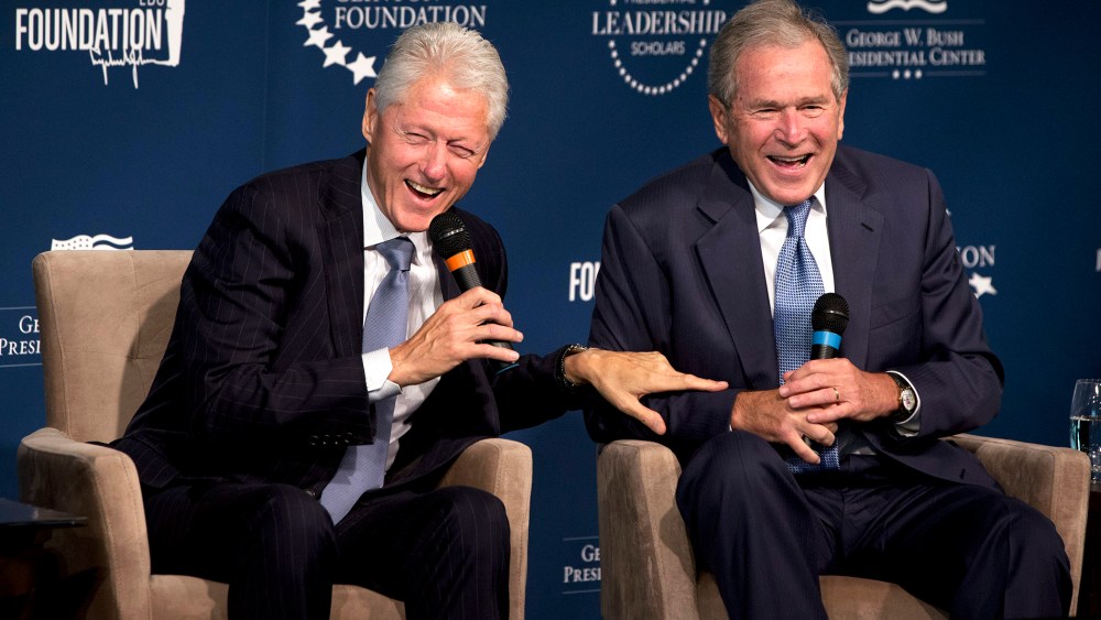 Former Presidents Bill Clinton, left, and George W. Bush, laugh while participating in the Presidential Leadership Scholars Program Launch, Sept. 8, 2014, at The Newseum in Washington, D.C. (Photo by Jacquelyn Martin/AP)