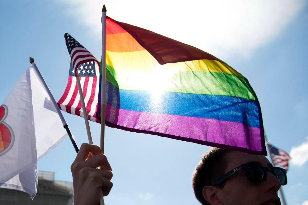 Same-sex marriage supporters rally in front of the Supreme Court.