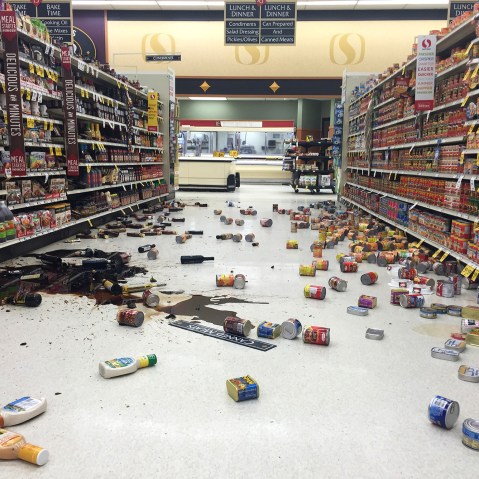Items fallen from the shelves litter the aisles inside a Safeway grocery store following a magnitude 6.8 earthquake on the Kenai Peninsula, Jan. 24, 2016, in south-central Alaska. (Photo by Vincent Nusunginya/AP)