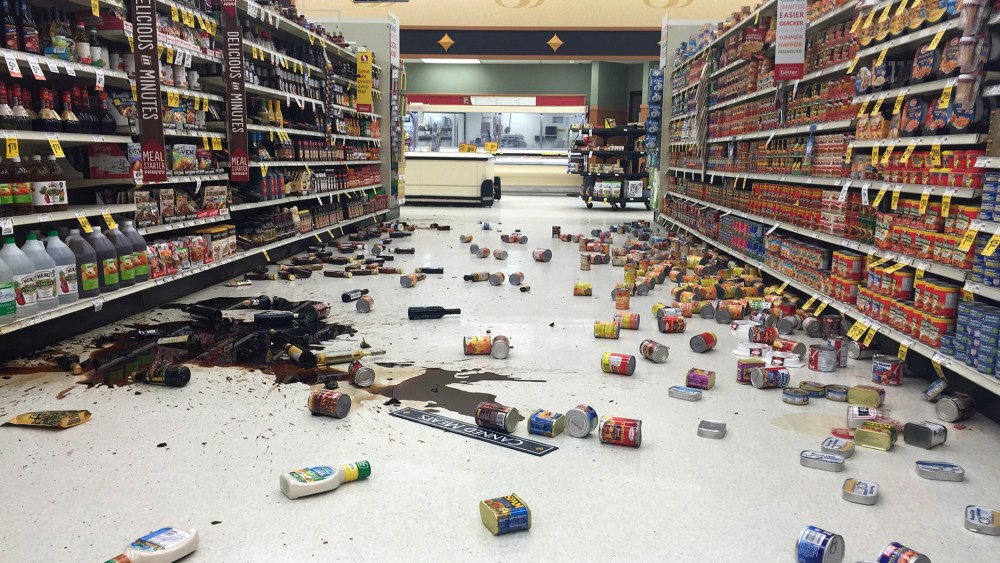 Items fallen from the shelves litter the aisles inside a Safeway grocery store following a magnitude 6.8 earthquake on the Kenai Peninsula, Jan. 24, 2016, in south-central Alaska. (Photo by Vincent Nusunginya/AP)
