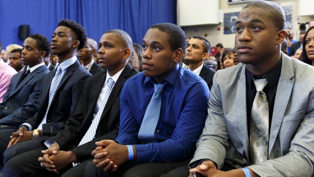 A group of young men listen as President Barack Obama speaks about the My Brother's Keeper Initiative, at the Walker Jones Education Campus in Washington, D.C., July 21, 2014.