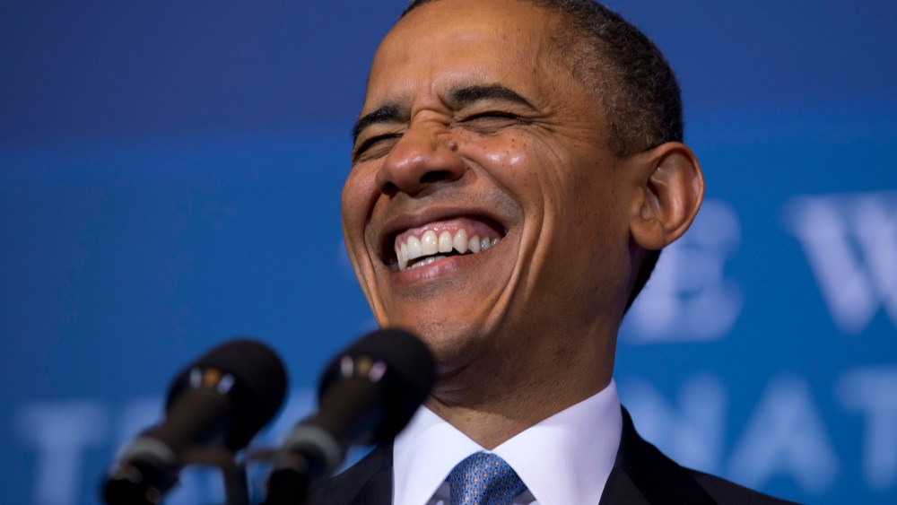 President Barack Obama laughs as he arrives to speak at the 2012 Tribal Nations Conference, Wednesday, Dec. 5, 2012, at the Interior Department in Washington. (Photo by Carolyn Kaster/AP)