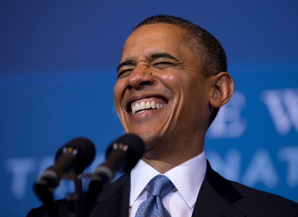 President Barack Obama laughs as he arrives to speak at the 2012 Tribal Nations Conference, Wednesday, Dec. 5, 2012, at the Interior Department in Washington. (Photo by Carolyn Kaster/AP)
