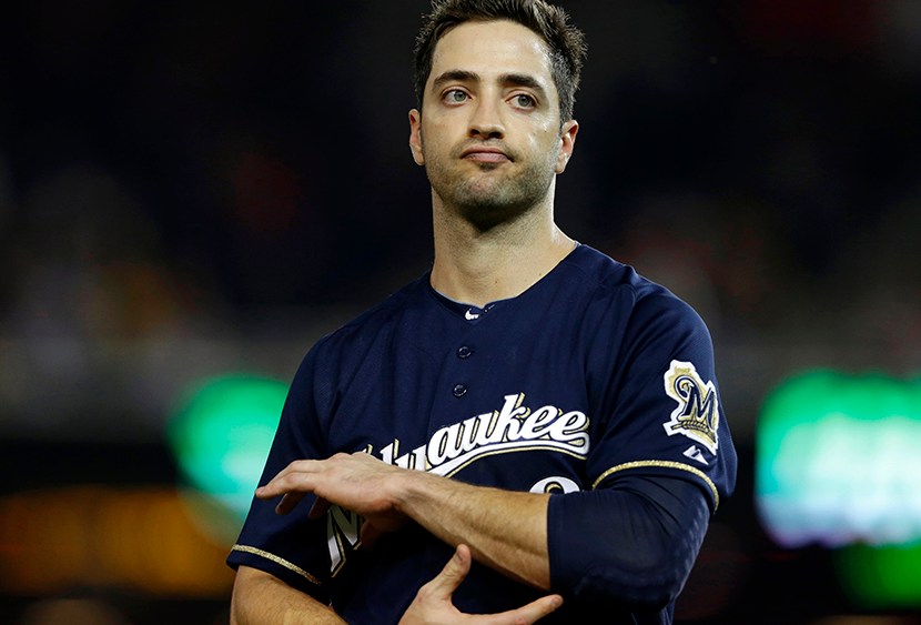 In this Sept. 21, 2012 file photo, Milwaukee Brewers Ryan Braun holds his elbow after missing a swing during a baseball game against the Washington Nationals at Nationals Park, in Washington. (Photo by Jacquelyn Martin/AP)