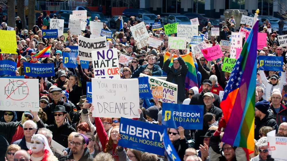 Thousands of opponents of Indiana Senate Bill 101, the Religious Freedom Restoration Act, gathered on the lawn of the Indiana State House to rally against that legislation, March 28, 2015. (Photo by Doug McSchooler/AP)