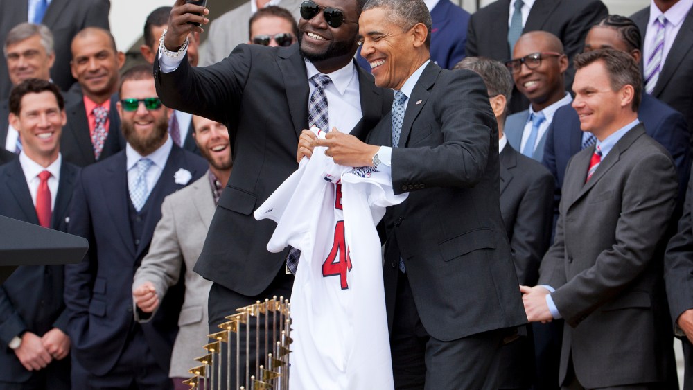 Boston Red Sox player David Ortiz, left, takes a selfie with President Barack Obama, April 1, 2014 on the South Lawn of the White House in Washington, where the president honored the Boston Red Sox on their 2013 World Series championship.
