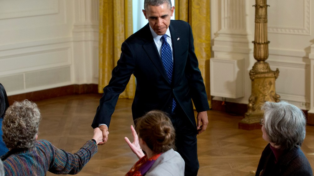 President Barack Obama shakes hands as he leaves the East Room of the White House in Washington, Jan. 22, 2014.