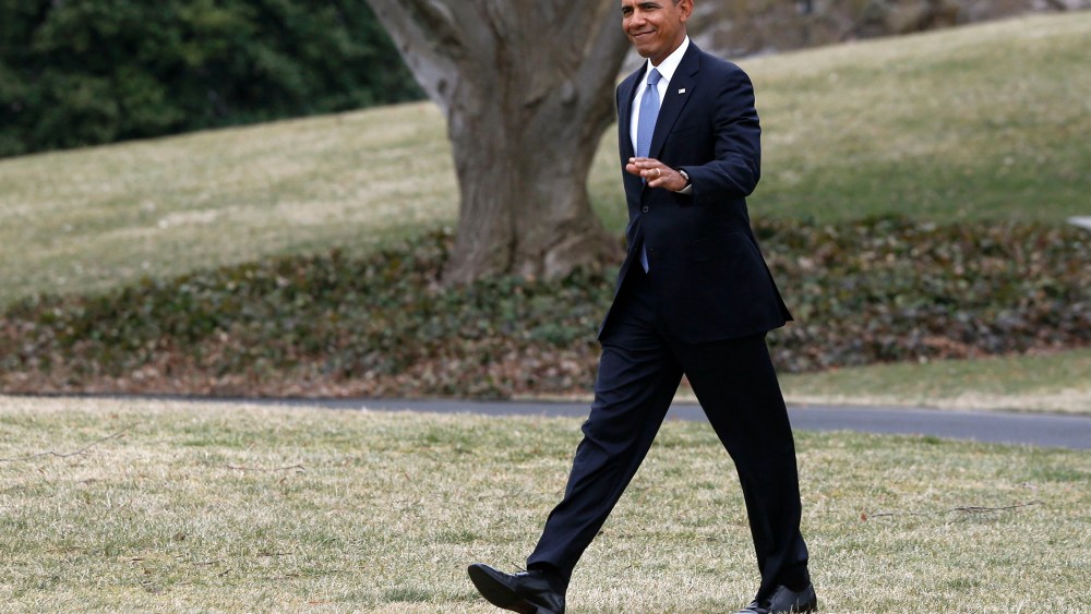 President Barack Obama walks on the South Lawn of the White House in Washington, on March 11, 2014.