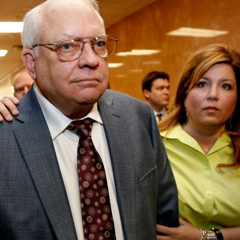 Robert Bates, left, leaves his arraignment with his daughter, Leslie McCreary, right, in Tulsa, Okla., on April 21, 2015. (Photo by Sue Ogrocki/AP)