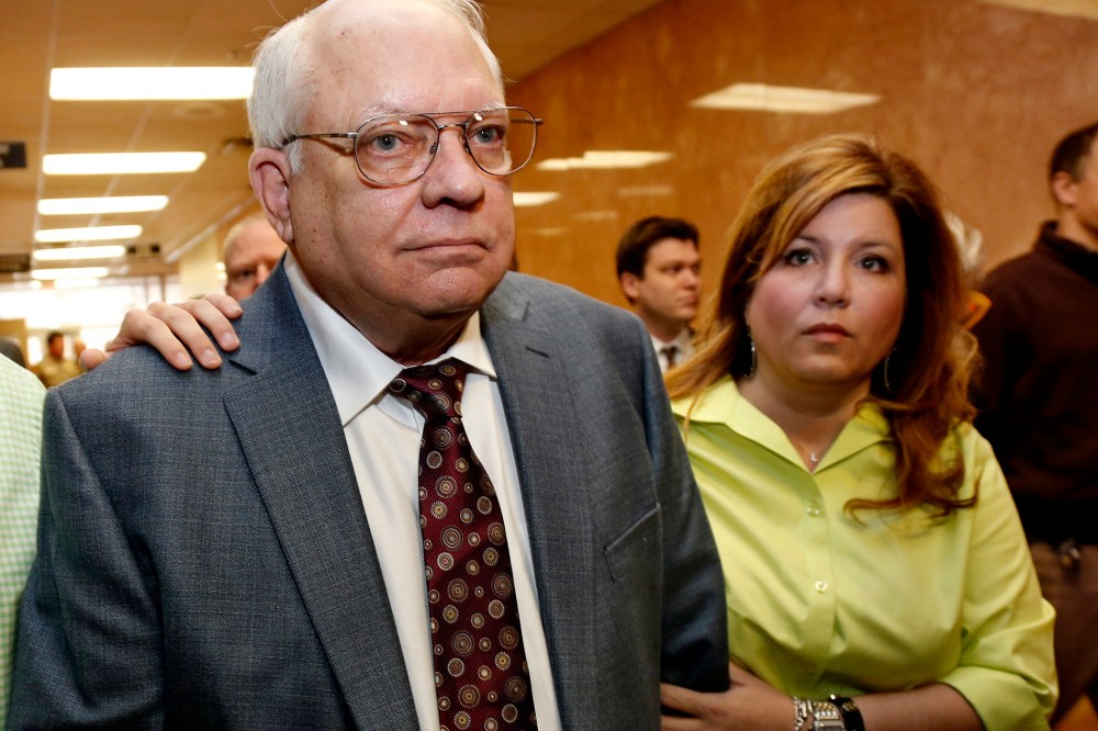 Robert Bates, left, leaves his arraignment with his daughter, Leslie McCreary, right, in Tulsa, Okla., on April 21, 2015. (Photo by Sue Ogrocki/AP)