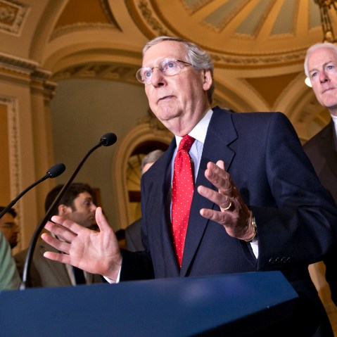 Senate Minority Leader Mitch McConnell of Ky., left, accompanied by Senate Minority Whip John Cornyn of Texas, center, and Sen. John Thune, R-S.D., Senate Republican Conference chairman, talks about the startup problems of the Affordable Care Act as they