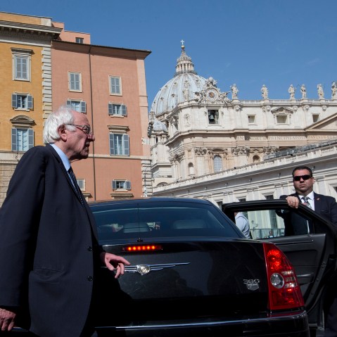 U.S. presidential candidate Bernie Sanders, backdropped by the dome of St. Peter's Basilica, at the Vatican, April 16, 2016. (Photo by Alessandra Tarantino/AP)