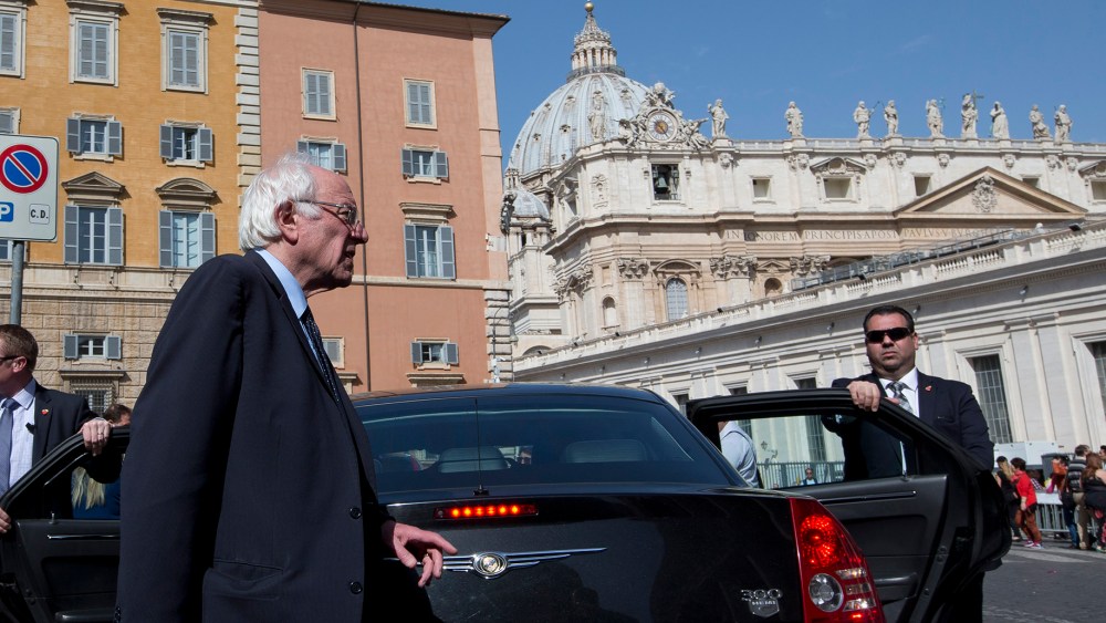 U.S. presidential candidate Bernie Sanders, backdropped by the dome of St. Peter's Basilica, at the Vatican, April 16, 2016. (Photo by Alessandra Tarantino/AP)