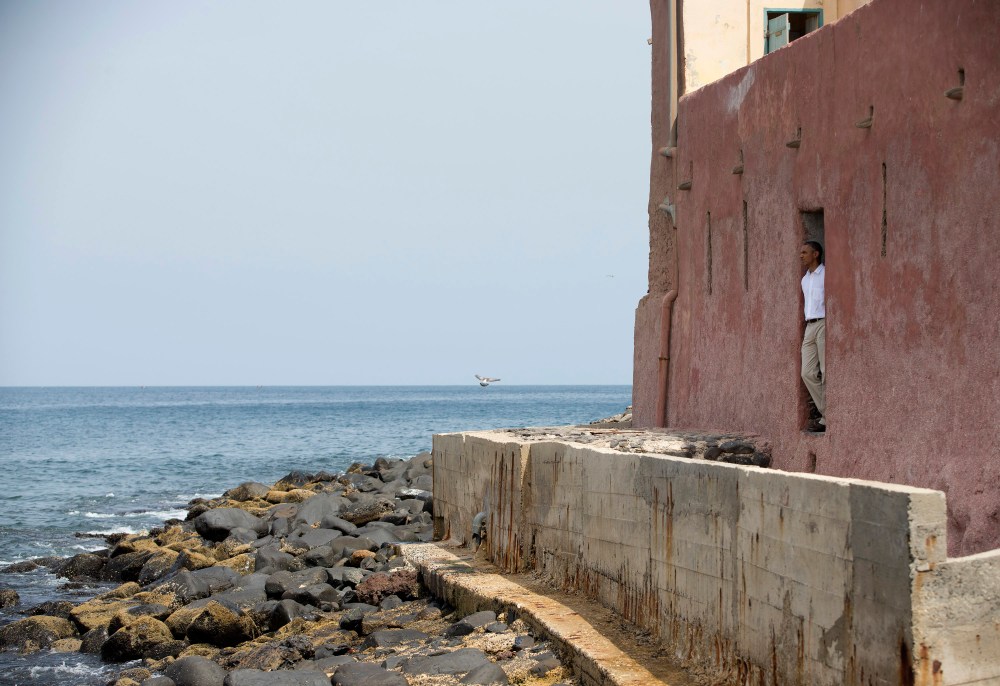 President Barack Obama looks out of the "door of no return" during a tour of Goree Island, Thursday, June 27, 2013, in Goree Island, Senegal. Goree Island is the site of the former slave house and embarkation point built by the Dutch in 1776, from...