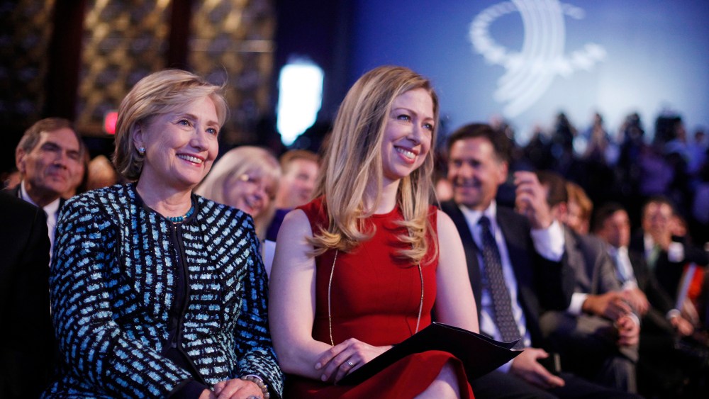 Former Secretary of State Hillary Rodham Clinton, left, and her daughter Chelsea Clinton, center, at the  Clinton Global Initiative in New York, Sept. 24, 2013.