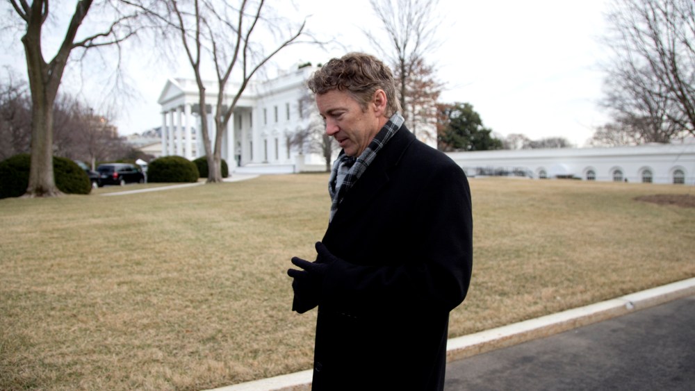 Rand Paul walks from the White House after an event hosted by Barack Obama about the Promise Zones Initiative, Jan. 9, 2014.