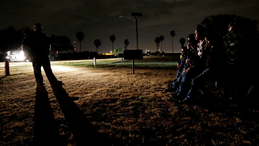 A group of immigrants from Honduras and El Salvador, who crossed the U.S.-Mexico border illegally, are stopped in Granjeno, Texas, on June 25, 2014.