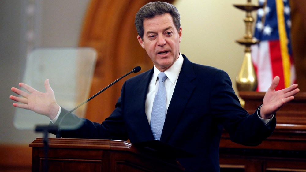 Kansas Gov. Sam Brownback delivers his State of the State speech to an annual joint session of the House and Senate at the Statehouse in Topeka, Kan., Wednesday, Jan. 15, 2014.  (Photo by Orlin Wagner/AP)