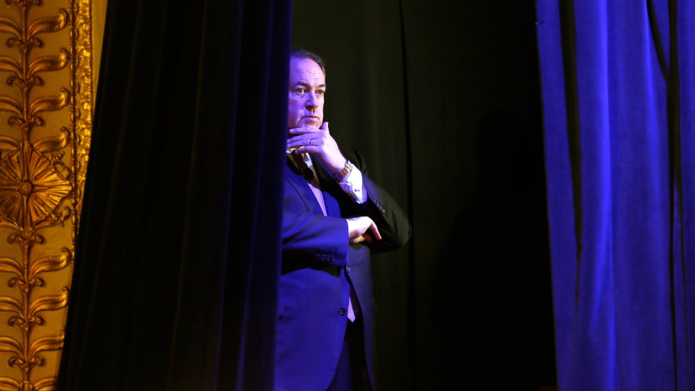 Former Arkansas Gov. Mike Huckabee waits backstage before speaking during the Freedom Summit, Jan. 24, 2015, in Des Moines, Iowa. (Photo by Charlie Neibergall/AP)