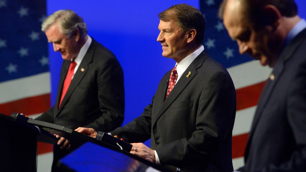 Independent candidate, Larry Pressler, left, Republican candidate, Mike Rounds, center and Democratic candidate Rick Weiland prepare before a televised U.S. Senate candidate debate Thursday night, on Oct. 23, 2014 in Vermillion, S.D.