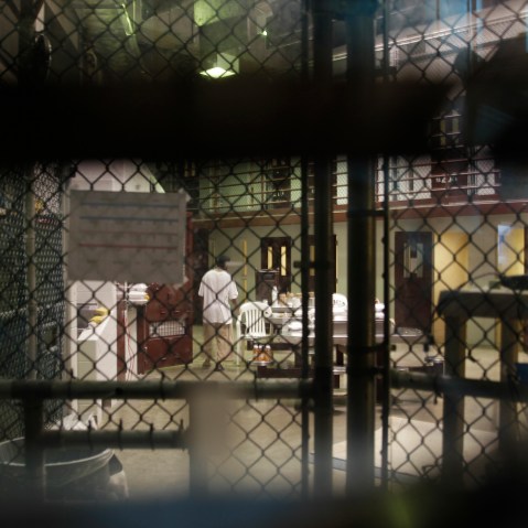 A prisoner walks through a communal pod inside an area of the Guantanamo Bay detention center known as Camp 6.