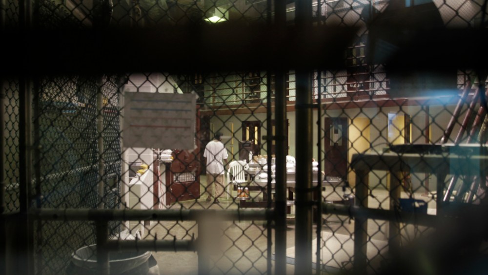 A prisoner walks through a communal pod inside an area of the Guantanamo Bay detention center known as Camp 6.