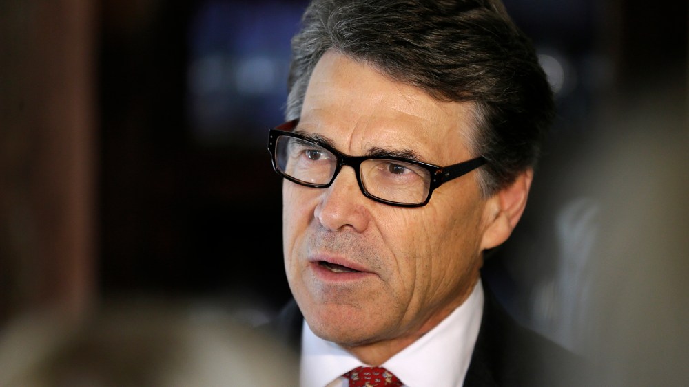 Texas Gov. Rick Perry speaks to reporters following an event, May 29, 2014, in Ames, Iowa.