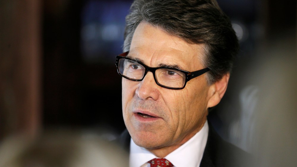 Texas Gov. Rick Perry speaks to reporters following a fund-raising breakfast for Iowa Gov. Terry Branstad, May 29, 2014, in Ames, Iowa.