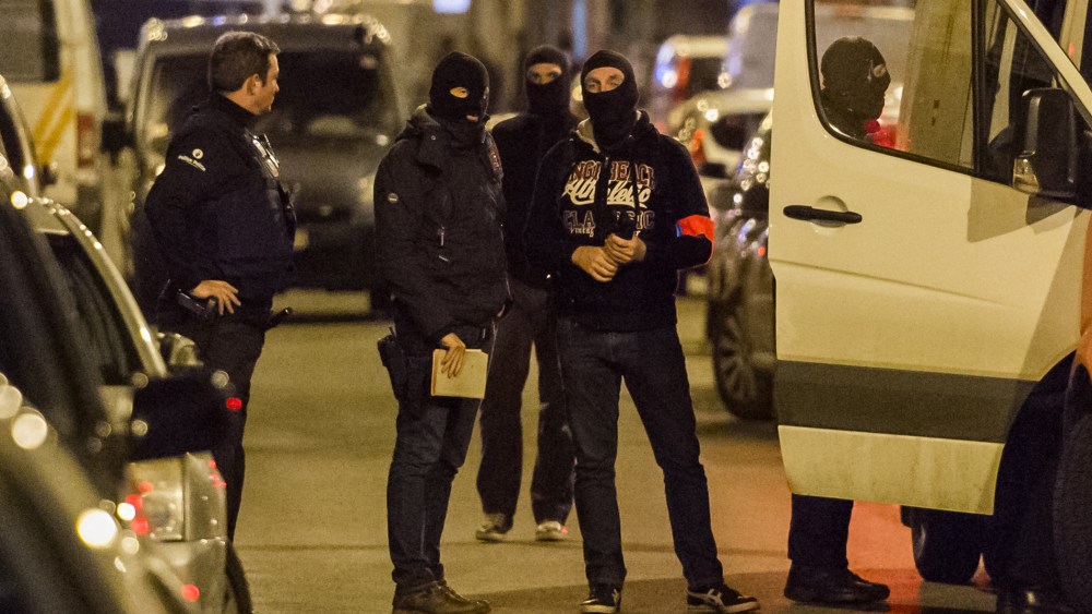 Police investigate an area where terror suspect Mohamed Abrini was arrested earlier in Brussels on April 8, 2016. (Photo by Geert Vanden Wijngaert/AP)