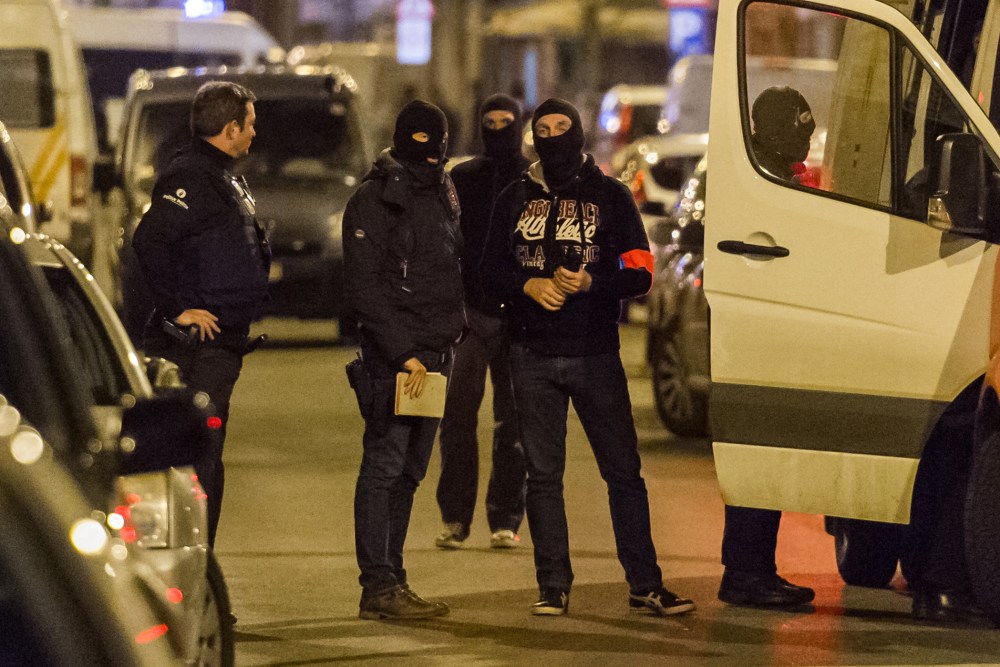 Police investigate an area where terror suspect Mohamed Abrini was arrested earlier in Brussels on April 8, 2016. (Photo by Geert Vanden Wijngaert/AP)