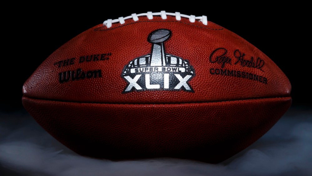 An official game ball for the NFL football Super Bowl XLIX is photographed, Jan. 20, 2015, at the Wilson Sporting Goods football factory in Ada, Ohio. (Photo by Rick Osentoski/AP)