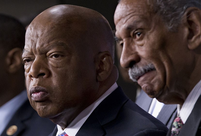 Rep. John Lewis, D-Ga., left, and Rep. John Conyers, D-Mich., right, co-chairs of the Civil Rights Taskforce of the Congressional Black Caucus, join other members of the House to express disappointment in the Supreme Court's decision on Shelby County v...