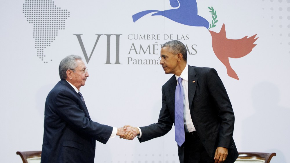 US President Barack Obama and Cuban President Raul Castro shake hands at the Summit of the Americas in Panama City, Panama, Saturday, April 11, 2015. (Photo by Pablo Martinez Monsivais/AP)