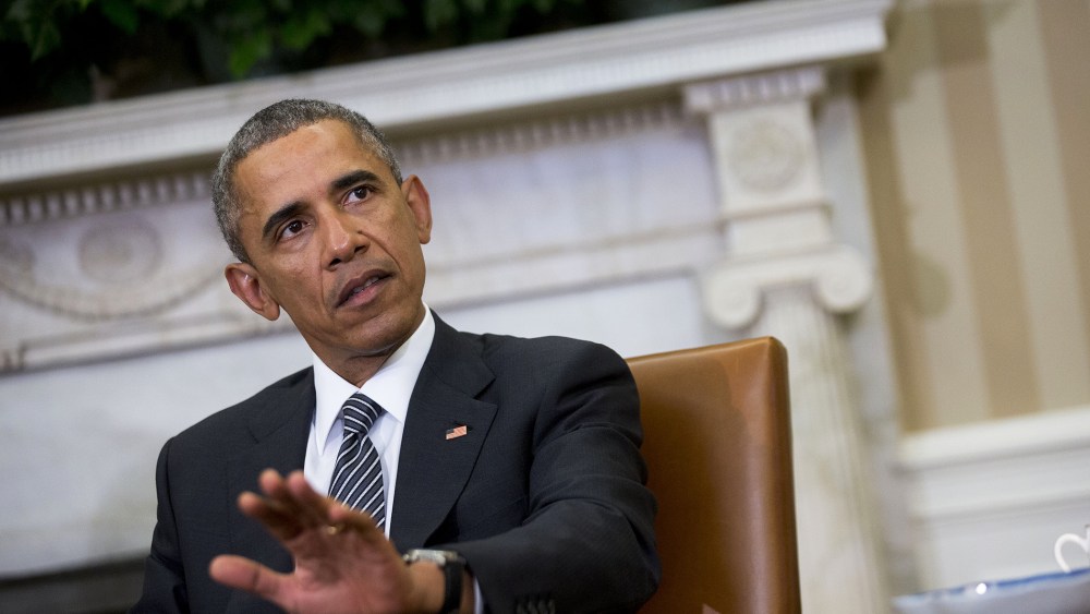President Obama is seen in the Oval Office on Feb. 17, 2015 in Washington, D.C. (Photo by Rex Features/AP)