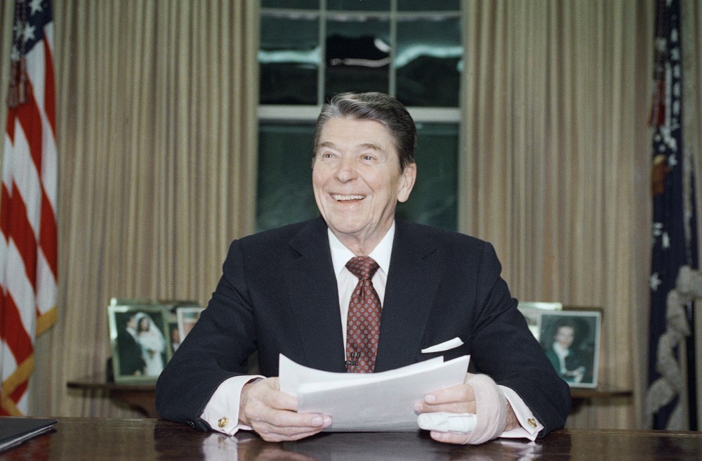 President Ronald Reagan poses for photographers in the Oval Office, Jan. 11, 1989 after delivering a televised farewell address to the nation.