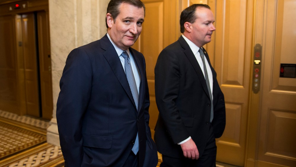 Presidential candidate Sen. Ted Cruz speaks with Sen. Mike Lee, R-Utah, as they leave the Senate floor following the cloture vote on the "American Security Against Foreign Enemies Act of 2015" on Jan. 20, 2016. (Photo By Bill Clark/CQ Roll Call/AP)