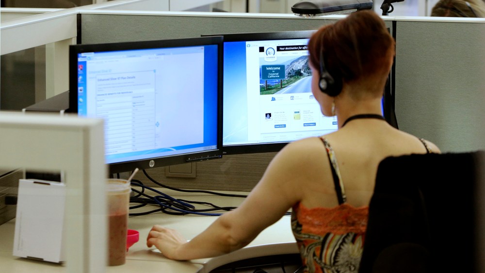 Gina Macaluso, an employee of  Covered California, the state's new health care exchange, provides health insurance at the  newly opened call center in Rancho Cordova, Calif., Tuesday, Oct. 1, 2013.