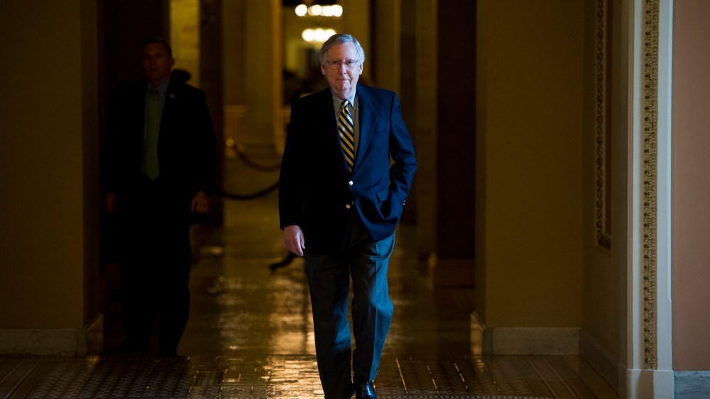Senate Majority Leader Mitch McConnell, R-Ky., walks to the Senate floor for the votes on funding the Department of Homeland Security on Feb. 27, 2015. (Photo By Bill Clark/CQ Roll Call/AP)