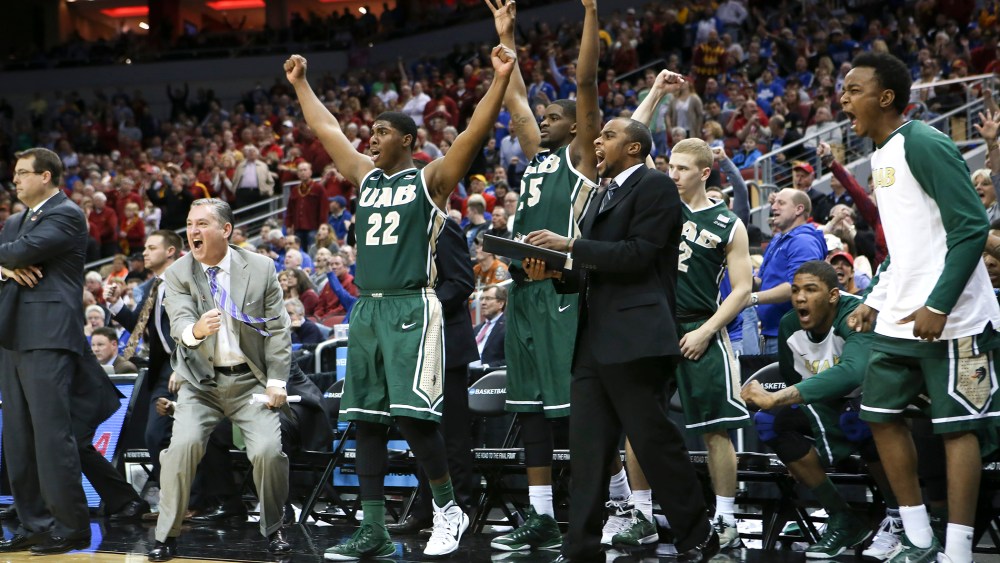 The UAB bench cheers after guard Robert Brown hit a 3-point basket in the closing seconds of the second half against Iowa State in the second round of the NCAA college basketball tournament in Louisville, Ky., March 19, 2015.(Photo by David Stephenson/AP)