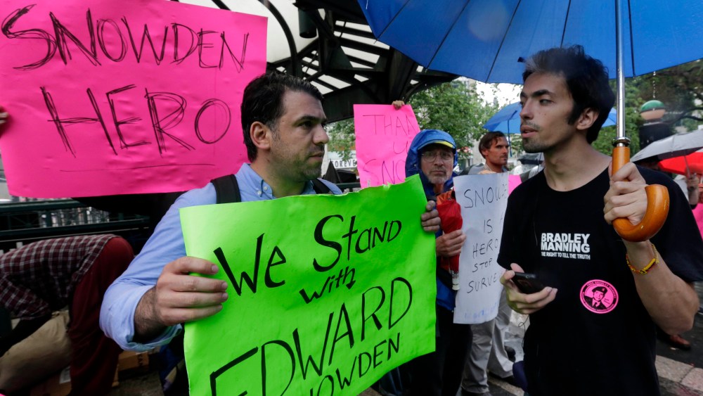 Demonstrators hold signs supporting Edward Snowden in New York's Union Square Park, Monday, June 10, 2013. Snowden, who says he worked as a contractor at the National Security Agency and the CIA, gave classified documents to reporters, making public...