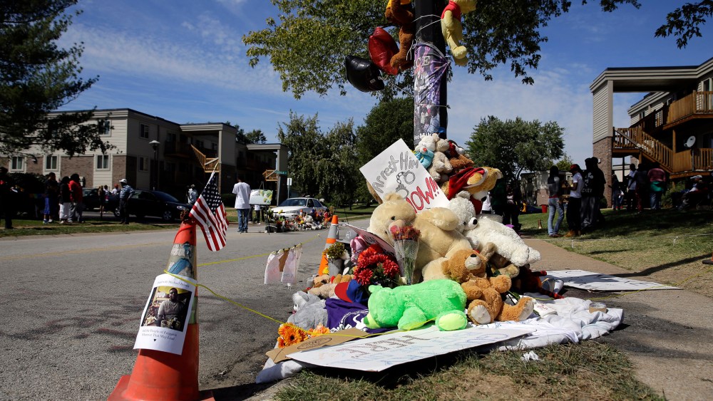 A memorial is cordoned off in Ferguson, Mo., near the spot of where Michael Brown was shot by Ferguson police office Darren Wilson. Sept. 23, 2014.