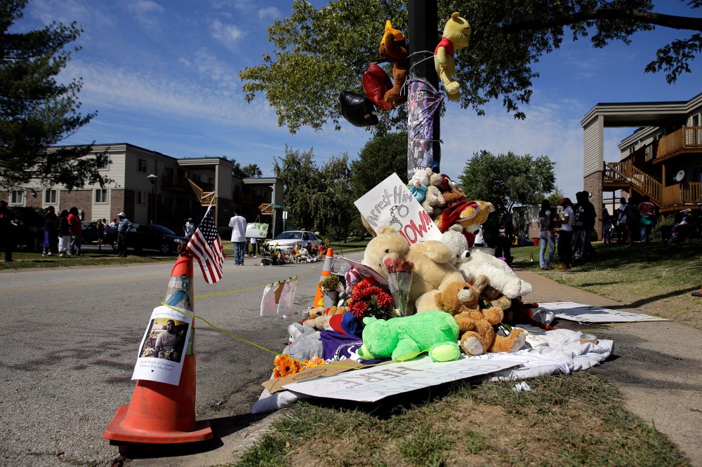 A memorial is cordoned off in Ferguson, Mo., near the spot of where Michael Brown was shot by Ferguson police office Darren Wilson. Sept. 23, 2014.