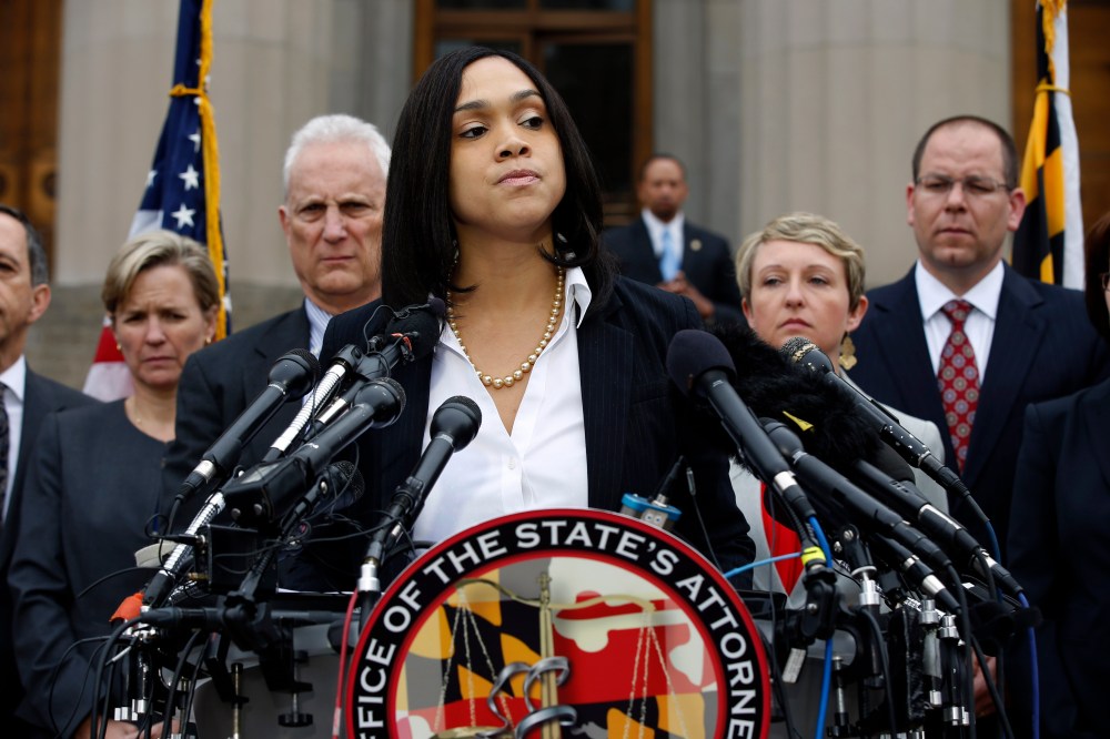 Marilyn Mosby, Baltimore state's attorney, pauses while announcing criminal charges against all six officers suspended after Freddie Gray suffered a fatal spinal injury in police custody, May 1, 2015 in Baltimore, Md. (Photo by Alex Brandon/AP)