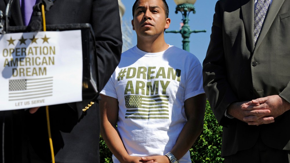 DREAM Action Coalition Co-Director Cesar Vargas, center, participates in a news conference on Capitol Hill in Washington, D.C., July 25, 2014. (Photo by AP)