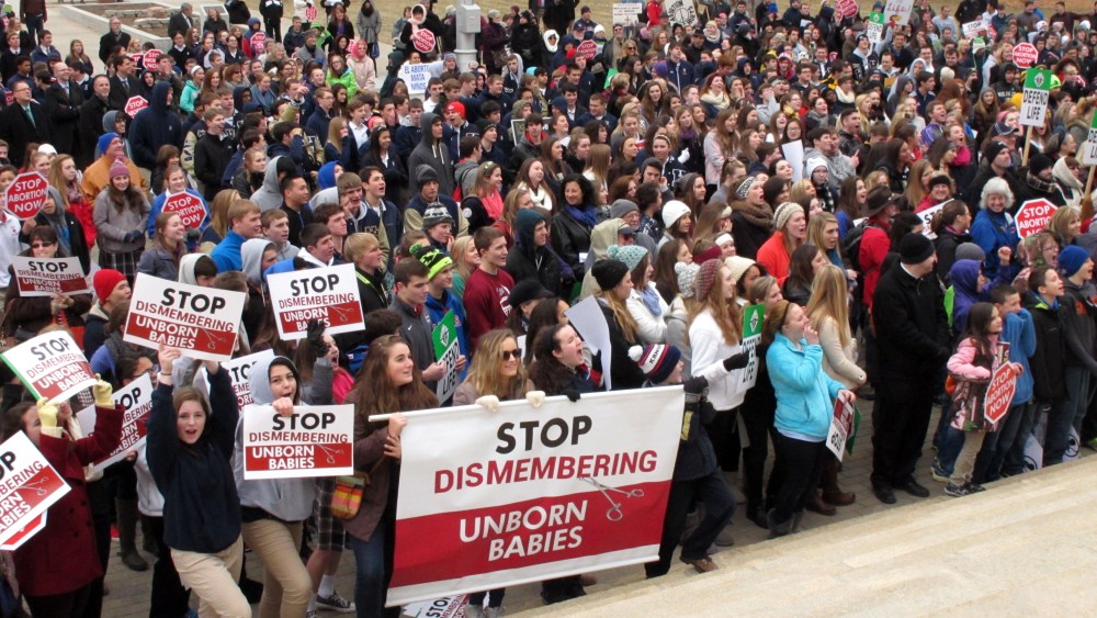 Hundreds of abortion opponents rally at the Kansas Statehouse, Jan. 22, 2015, in Topeka. The rally was sponsored by Kansans for Life on the 42nd anniversary of the U.S. Supreme Court decision legalizing abortion across the nation. (Photo by John Hanna/AP)