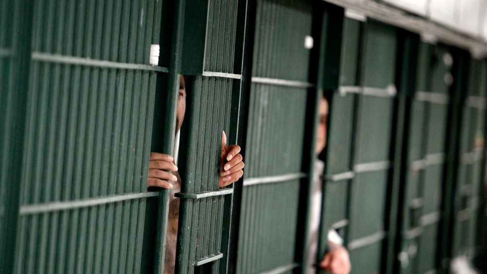 Prison bars on Oct. 3, 2012. (Photo by Reed Saxon/AP)