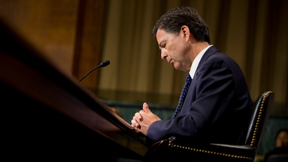 FBI Director then-nominee James Comey pauses as he testifies on Capitol Hill in Washington, July 9, 2013, before the Senate Judiciary Committee hearing on his nomination. (Photo by Evan Vucci/AP)