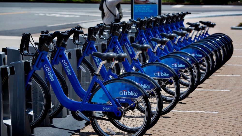 Bicycles, part of the NYC Bike Share program, are lined up at a dock and lock station at the Brooklyn Navy Yards Sunday, May 12, 2013 in New York. The expanding bike share system allows those who join to ride bicycles and return them from the same or...