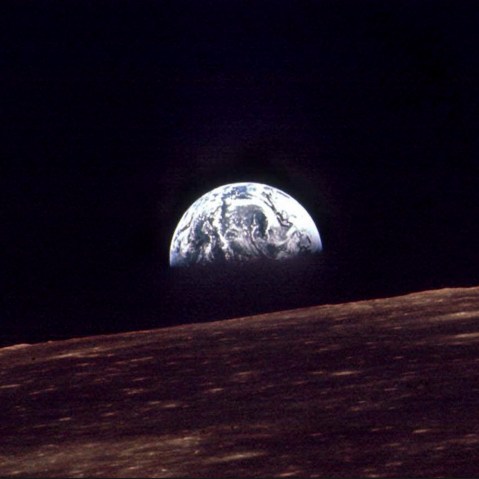 n this Dec. 24, 1968 file photo, the Earth shines over the horizon of the Moon in as seen by the astronauts on Apollo 8.
