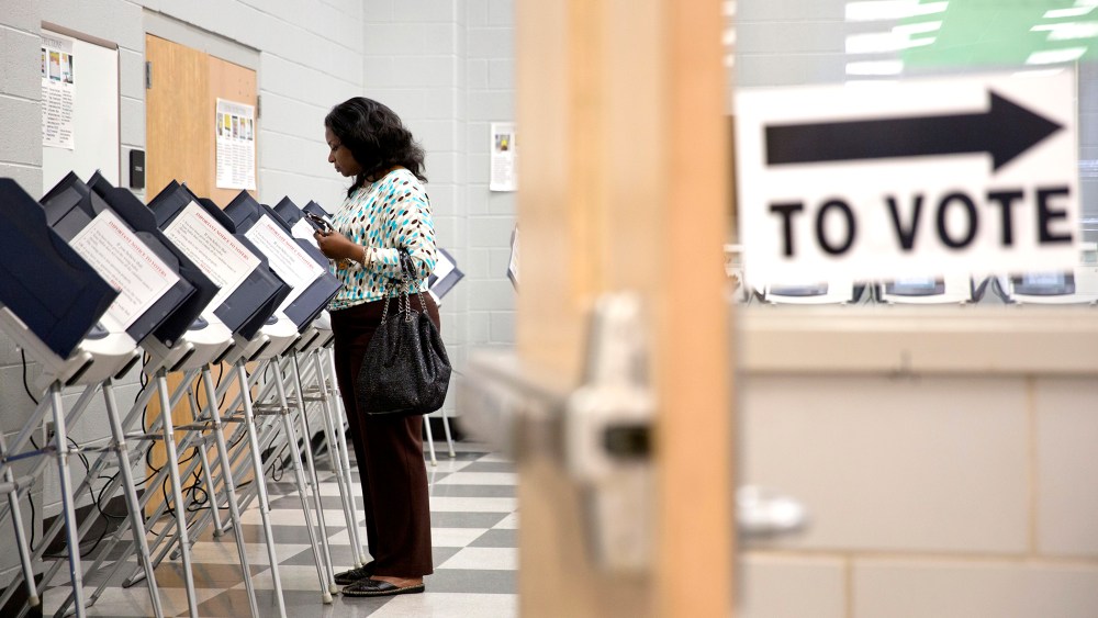 A voter casts her ballot at a polling site during early voting for Georgia's primary election in Atlanta on May, 16, 2014.